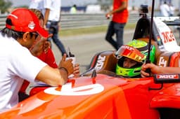 MRF brand ambassador Narain Karthikeyan with Mick Schumacher on the grid.