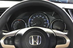 The 3-pod instrument cluster now gets a new design which features blue backlighting as well as a multi-function display