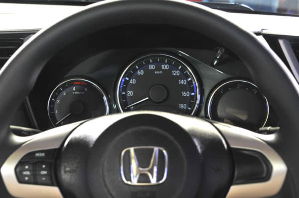 The 3-pod instrument cluster now gets a new design which features blue backlighting as well as a multi-function display