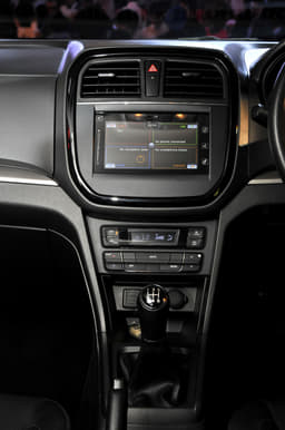 The gloss black trim surround for the central air con vents and infotainment system give the dashboard a neat look.