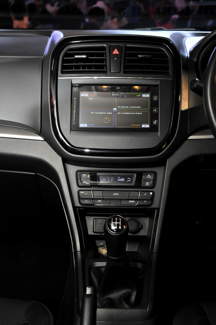 The gloss black trim surround for the central air con vents and infotainment system give the dashboard a neat look.