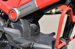 What is novel is that the engine bay can accommodate a storage bin. The actual engine sits at the rear like that in a conventional scooter.