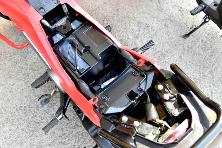 Under-seat storage is minimal and is mainly occupied by the air-box.