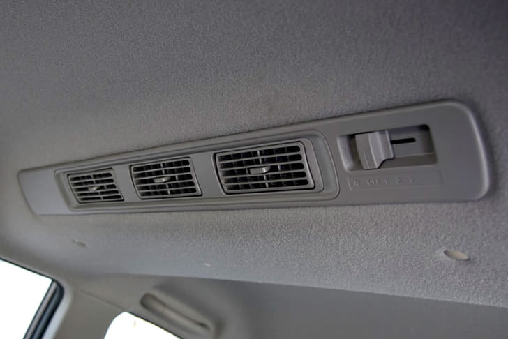 Second-row occupants get roof mounted air-con vents with blower controls.