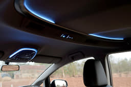 Cool white band of LED ambient lighting on the ceiling is subtle and really well executed.