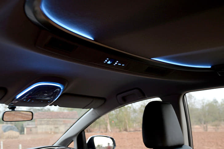 Cool white band of LED ambient lighting on the ceiling is subtle and really well executed.