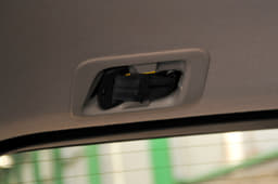 Third row middle seat has a three-point seatbelt that spools out of the ceiling.