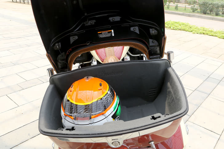 The large trunk at the back can easily swallow two full-face helmets whole.
