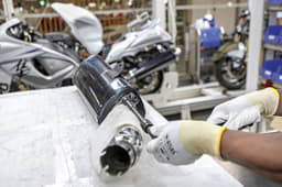 Soft cloth protects exhaust pipe while attaching end can.