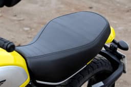 While the Scrambler’s seat is quite soft, its shape is rather odd and it can make even the shortest rides out of the city feel like you’re participating in a Bun Burner challenge.