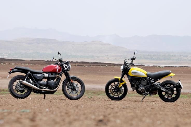 Both bikes are modern interpretations of designs from the early 1960s and represent a distinct shift away from the highly specialised motorcycles that you see today. Both bikes are modern interpretations of designs from the early 1960s and represent a distinct shift away from the highly specialised motorcycles that you see today.