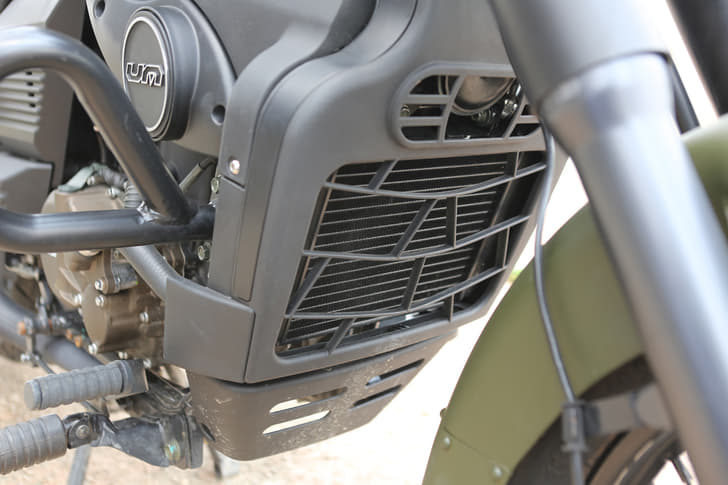 Shrouded heat exchanger for the liquid-cooled engine gives it a cleaner look.