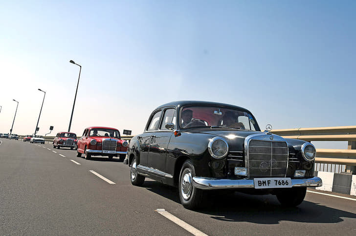 A rare procession of classic Mercedes-Benz cars.