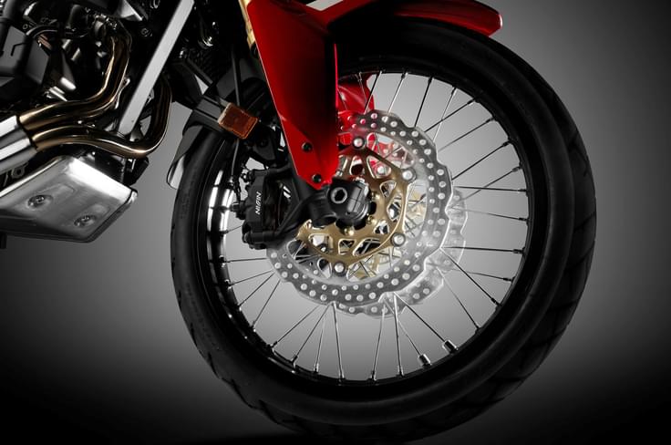 The Africa Twin rides on wire spoke wheels to stay true to its off-road credentials. The Africa Twin rides on wire spoke wheels to stay true to its off-road credentials.