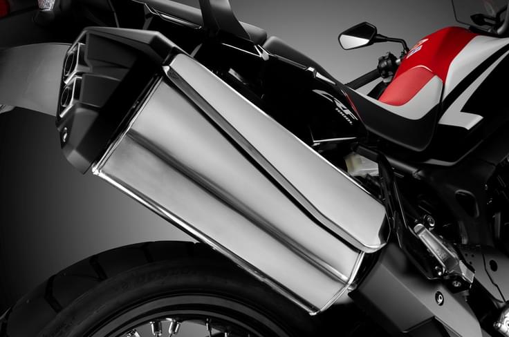 The Africa Twin features a two-into-two exhaust with a unified muffler. The Africa Twin features a two-into-two exhaust with a unified muffler.