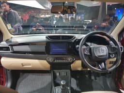 Dashboard is all-new. It gets a beige and black interior colour theme.