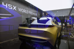 High set tail lamps and exaggerated surfacing define the rear end. Note split rear spoiler. 