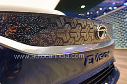 Faux grille bejewelled with pins in a tri-arrow pattern. 