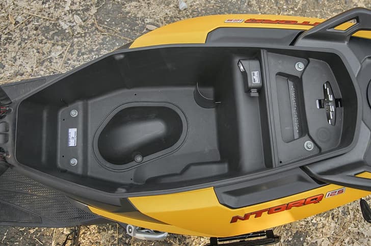 Generous underseat storage area on the Ntorq 125.