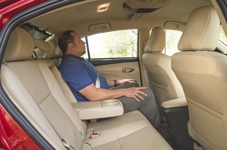 Six footers will brush their heads, but for the rest of us rear seat works quite well.