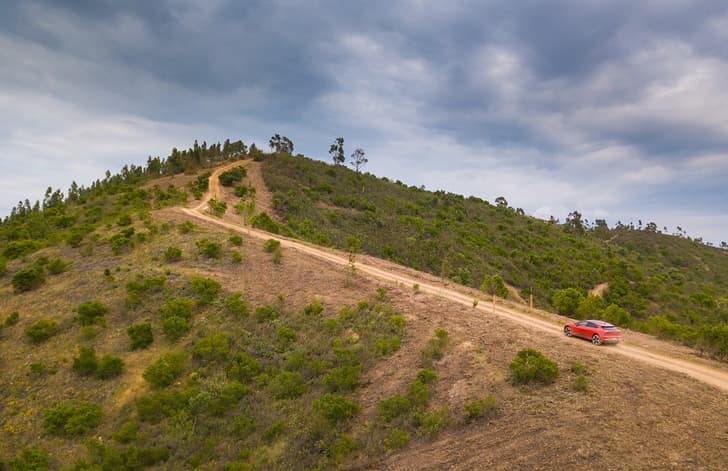 All Surface Progress Control helps I-Pace keep momentum in the rough.