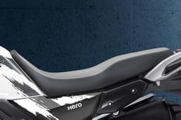 The one-piece seat extends onto the fuel tank, giving it a dual-sport-like appearance.