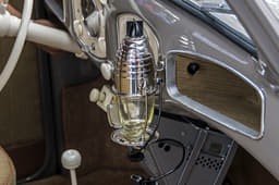 It even comes with its very own dash-mounted coffee maker, which runs off of a six-volt power outlet.