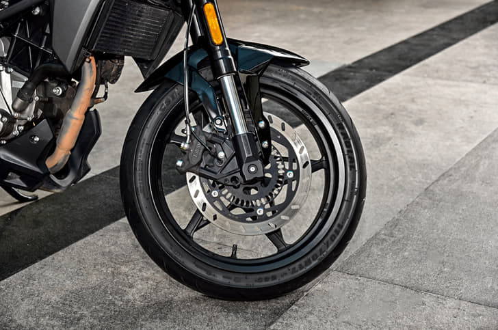 The CFMoto features unique star-shaped five-spoke alloy wheels.