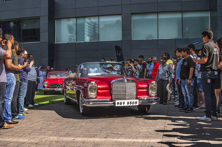 The Mercedes-Benz 220SE takes to the road. 
