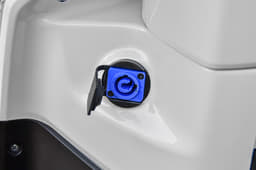 The charging port on the TVS iQube is located on the inside of the apron.