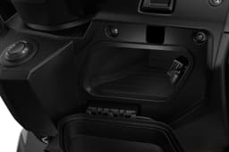 Storage cubby behind the apron houses a USB charging port.