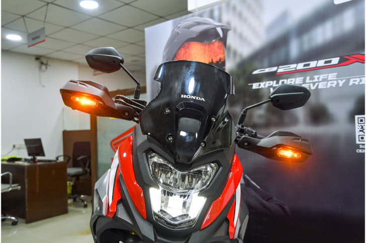 Changes up front include the addition of a semi-fairing, tinted windscreen and handguards. 