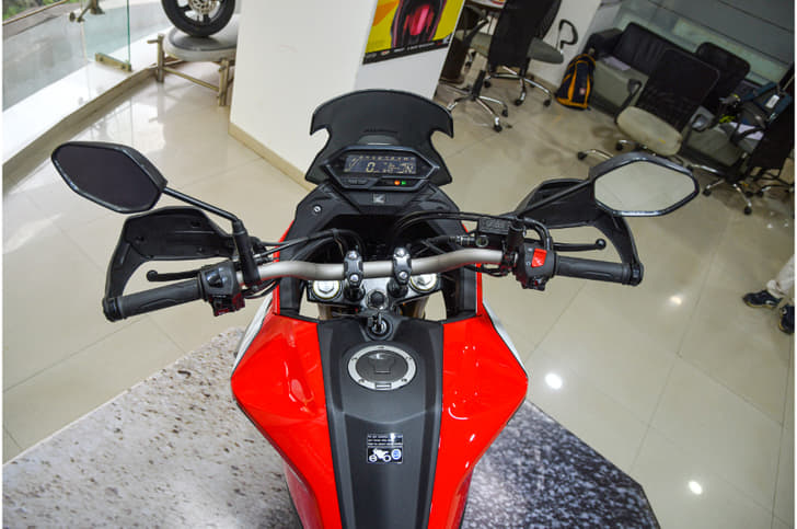 The wider and taller handlebar results in a more commanding riding position, and combined with the windscreen, makes for a more touring-friendly motorcycle.
