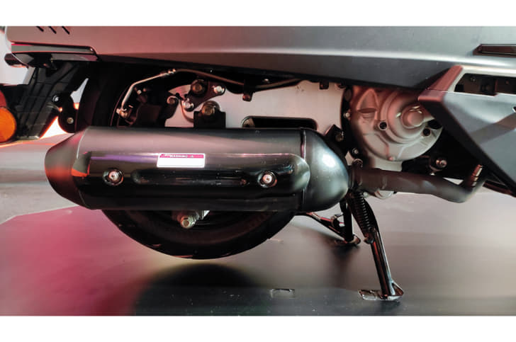 The cylindrical exhaust end-can sticks out in contrast to the square-ish design employed for the tail section.