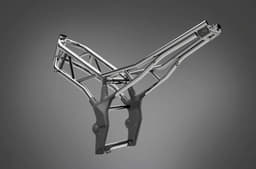 The engine is nestled in a brand-new steel trellis frame.