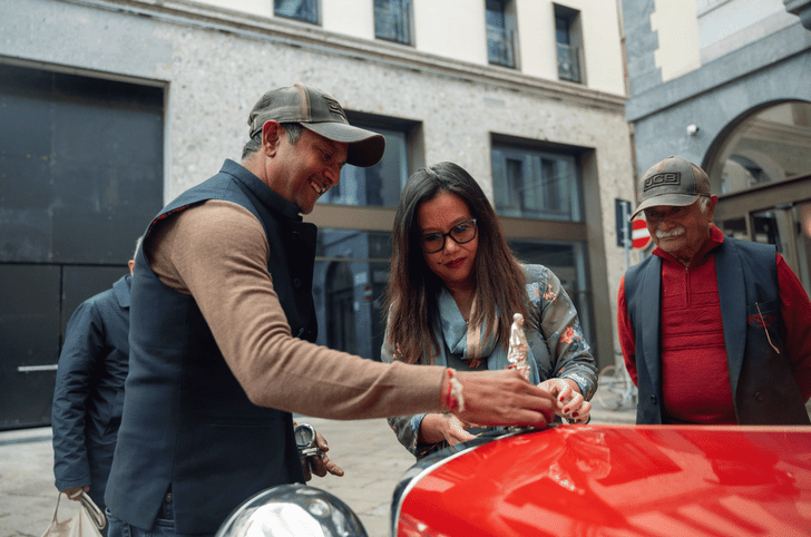 Milan Counsel General Mrs T Agungla Jamir welcomes the car and the team.