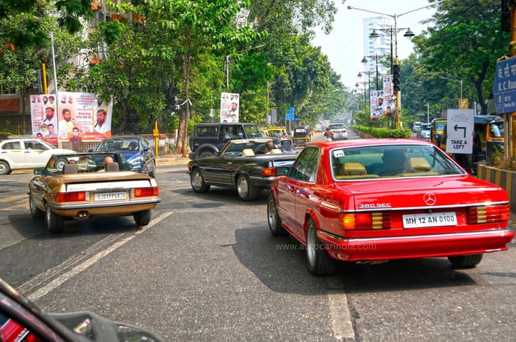 A convoy of iconic Mercedes-Benz models cruising through the rally route.