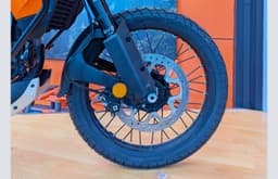 It runs on tubeless 21/17-inch wire-spoke wheels.