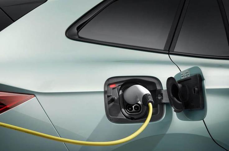 The charging port is neatly integrated into the front right fender, with a backlit Škoda logo and an illuminated surround for easy access in low light. The flap opens smoothly, revealing CCS/Type 2 compatibility for fast charging. Charging port