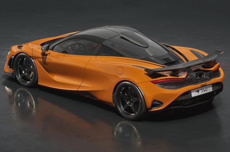 An orange McLaren 750S Le Mans Edition rear left side in a studio McLaren 750S Le Mans Edition side orange