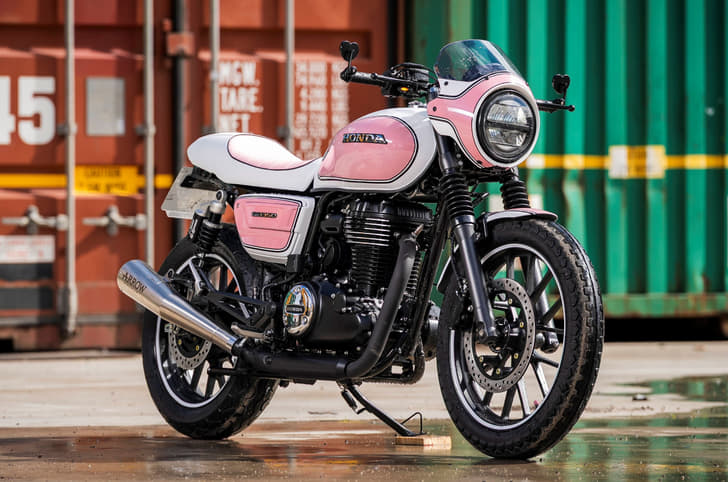 Honda CB350 in a neo-retro avatar with a half-bikini fairing and pink/white colour scheme