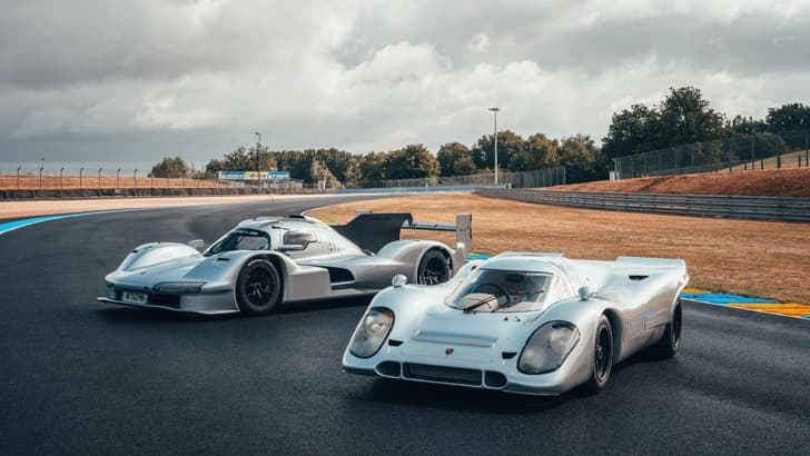 Porsche 963 RSP and 1970s 917 standing next to each other on a track