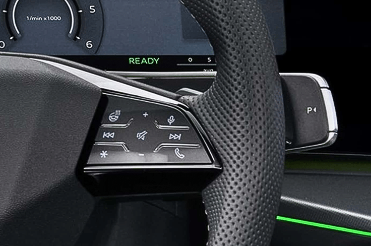 A gear-selector stalk behind the steering replaces the traditional unit. Audi Q3 steering wheel buttons