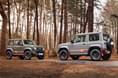 Suzuki Jimny 55th Anniversary Edition facing each other in forest Suzuki Jimny 55th Anniversary Edition facing each other in forest