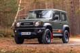 Suzuki Jimny 55th Anniversary Edition exterior in forest Suzuki Jimny 55th Anniversary Edition exterior in forest