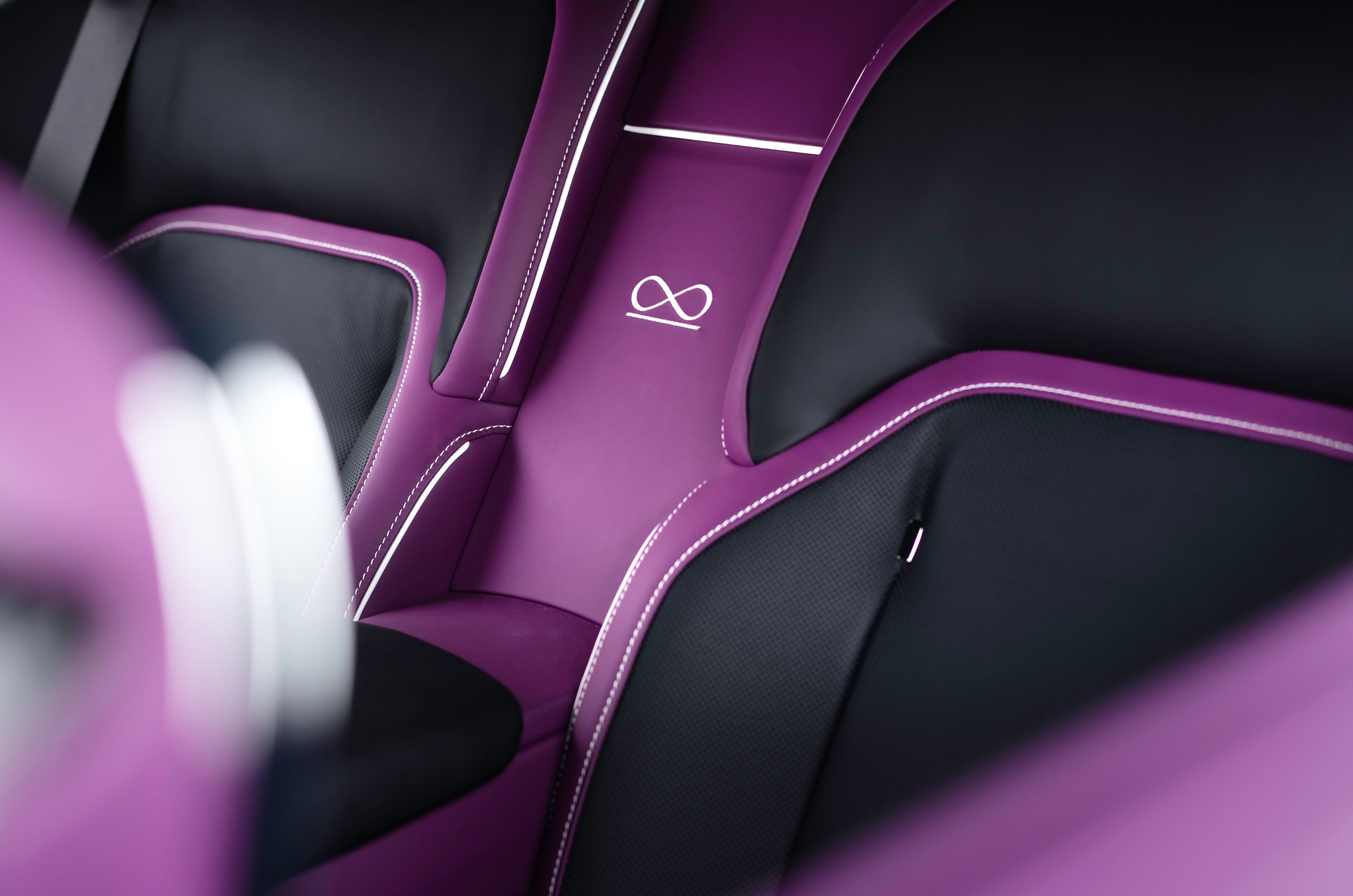 Infinity symbols on the fascia and rear seat ‘Waterfall’ section are unique to the Spectre Black Badge.