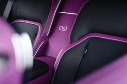 rolls royce spectre black badge rear seat infinity symbol