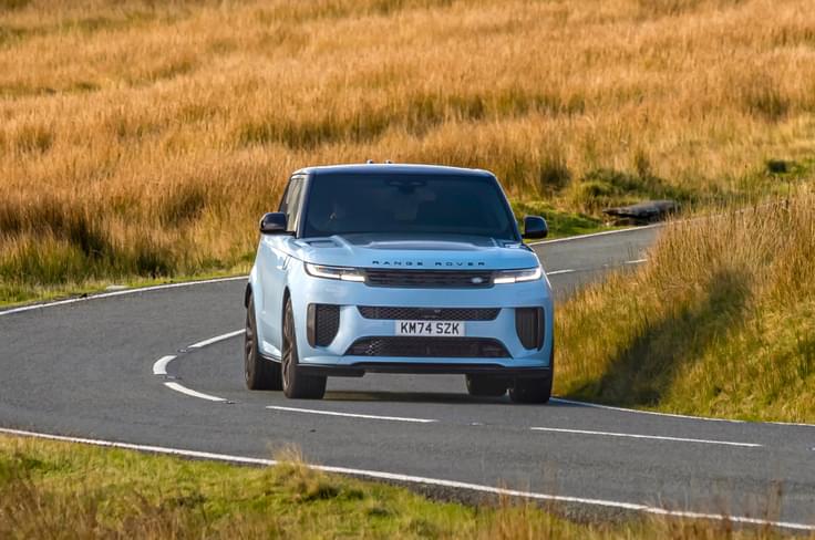 Clever chassis systems work hard to allow the two and half tonne SUV hold its line around corners. Range Rover Sport SV Edition Two in motion blue colour