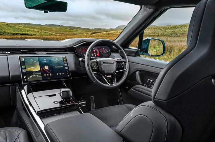 The cabin is minimalistic, although a bit bland. Range Rover Sport SV Edition Two interior steering wheel and touchscreen