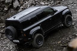 defender octa black edition in field